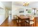 Dining area with wood table and chairs, parquet floor, and kitchen access at 1380 Gulf Blvd # 307, Clearwater Beach, FL 33767