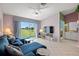 Relaxing living room with sectional sofa and sliding doors leading to a balcony at 6131 Bahia Del Mar Blvd # 236, St Petersburg, FL 33715