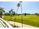 Expansive golf course view with palm trees and a pond at 6131 Bahia Del Mar Blvd # 236, St Petersburg, FL 33715