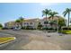 Condo building with parking and tropical landscaping at 6131 Bahia Del Mar Blvd # 236, St Petersburg, FL 33715