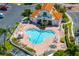 Community pool with surrounding lounge chairs and a spa at 6131 Bahia Del Mar Blvd # 236, St Petersburg, FL 33715