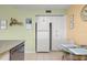 White kitchen with stainless steel appliances and breakfast nook at 6131 Bahia Del Mar Blvd # 236, St Petersburg, FL 33715
