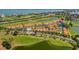 Aerial view showcasing property location in a community with pools and golf course at 6131 Bahia Del Mar Blvd # 236, St Petersburg, FL 33715