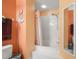 Bathroom with a large tub/shower and peach colored walls at 6131 Bahia Del Mar Blvd # 236, St Petersburg, FL 33715