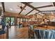 Expansive living room with hardwood floors, exposed beams, and a cozy seating area at 3204 Polo Pl, Plant City, FL 33566