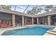 Relaxing pool and patio area with covered seating and brick pavers at 3204 Polo Pl, Plant City, FL 33566