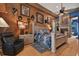 Main bedroom with king-size bed, fireplace, and hardwood floors at 3204 Polo Pl, Plant City, FL 33566