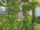 Aerial view of house with pool and tennis court on a large lot at 3204 Polo Pl, Plant City, FL 33566