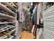 Large walk-in closet with ample shelving and drawers for storage at 3204 Polo Pl, Plant City, FL 33566