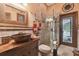 Rustic bathroom with copper sink, glass shower, and decorative tile at 3204 Polo Pl, Plant City, FL 33566