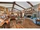 Open living space featuring a stone fireplace and hardwood floors at 3204 Polo Pl, Plant City, FL 33566