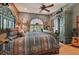 Primary bedroom with a large bed and views of the backyard at 3204 Polo Pl, Plant City, FL 33566