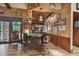 Custom wet bar with granite countertop and rustic wooden cabinets at 3204 Polo Pl, Plant City, FL 33566