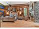 Spacious main bedroom with a large bed, fireplace, and hardwood floors at 3204 Polo Pl, Plant City, FL 33566