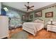 Bedroom with a queen-size bed and hardwood floors at 3204 Polo Pl, Plant City, FL 33566