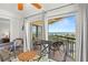 Dining area with balcony access and stunning ocean view at 4510 Gulf Blvd # 508, St Pete Beach, FL 33706