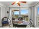 Ocean view dining area with balcony access at 4510 Gulf Blvd # 508, St Pete Beach, FL 33706