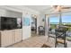 Living room with ocean view, bedroom peek, and dining area at 4510 Gulf Blvd # 508, St Pete Beach, FL 33706