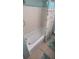 Clean bathroom with a bathtub and shower at 9901 111Th Ln, Seminole, FL 33772