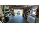 Open garage with car and storage options at 9901 111Th Ln, Seminole, FL 33772