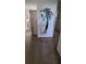 Hallway with a unique palm tree mirror at 9901 111Th Ln, Seminole, FL 33772