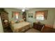 Bedroom with a double bed and wooden dresser at 9901 111Th Ln, Seminole, FL 33772