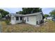 Back of the house showing a patio area with grill at 9901 111Th Ln, Seminole, FL 33772