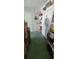 Garage with shelving, providing ample storage space at 9901 111Th Ln, Seminole, FL 33772