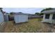 White shed in the backyard, surrounded by grass at 9901 111Th Ln, Seminole, FL 33772