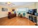 Bright home office features wood floors, large window, and built-in desk at 2228 Swedish Dr # 42, Clearwater, FL 33763
