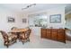 Charming dining area with wicker chairs and a wood cabinet at 2228 Swedish Dr # 42, Clearwater, FL 33763