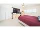 Bright main bedroom with large TV, mirrored wall, and ample storage space at 2228 Swedish Dr # 42, Clearwater, FL 33763