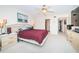 Comfortable main bedroom featuring carpeted floors, ceiling fan, and a decorative headboard at 2228 Swedish Dr # 42, Clearwater, FL 33763