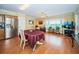 Bright dining area with bay window and wood flooring at 2228 Swedish Dr # 42, Clearwater, FL 33763