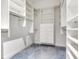Large walk-in closet with ample shelving and hanging space at 3425 Overlook Ne Dr, St Petersburg, FL 33703