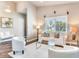 Spacious living area with white seating and a view to entryway at 3425 Overlook Ne Dr, St Petersburg, FL 33703