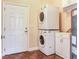 Laundry room with washer, dryer, and storage cabinets at 3425 Overlook Ne Dr, St Petersburg, FL 33703