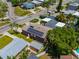 Aerial view of a home with solar panels, a detached shed and a pool in the backyard at 3425 Overlook Ne Dr, St Petersburg, FL 33703