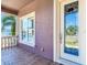 Bright front porch with tiled flooring and a view of the street at 3425 Overlook Ne Dr, St Petersburg, FL 33703