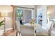 Casual dining area with white table and chairs, opens to patio at 3425 Overlook Ne Dr, St Petersburg, FL 33703