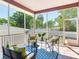 Relaxing screened porch with patio furniture and tiled floor at 3425 Overlook Ne Dr, St Petersburg, FL 33703