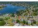 Aerial view showcasing a house's location near a lake in a quiet neighborhood at 3425 Overlook Ne Dr, St Petersburg, FL 33703