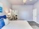 Serene bedroom with ceiling fan and mirrored closet doors at 3425 Overlook Ne Dr, St Petersburg, FL 33703