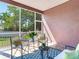 Screened porch with seating area, offering a shaded retreat at 3425 Overlook Ne Dr, St Petersburg, FL 33703