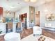 Open floor plan with kitchen, breakfast bar, and living space at 3425 Overlook Ne Dr, St Petersburg, FL 33703