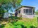 House exterior with backyard view, showing shed and fence at 3425 Overlook Ne Dr, St Petersburg, FL 33703