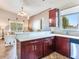 Well-equipped kitchen with dark wood cabinets and island at 3425 Overlook Ne Dr, St Petersburg, FL 33703