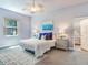 Spacious bedroom with plush carpet, ceiling fan, and en-suite bathroom at 3425 Overlook Ne Dr, St Petersburg, FL 33703