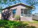 House exterior showcasing backyard and screened porch at 3425 Overlook Ne Dr, St Petersburg, FL 33703