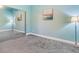Bright bedroom with mirrored closet doors and gray carpeting at 3425 Overlook Ne Dr, St Petersburg, FL 33703